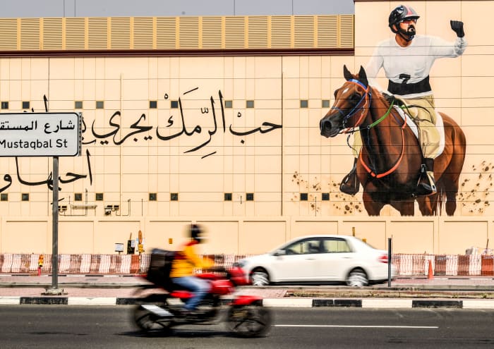 The sheikh's equestrian image looms in Dubai.